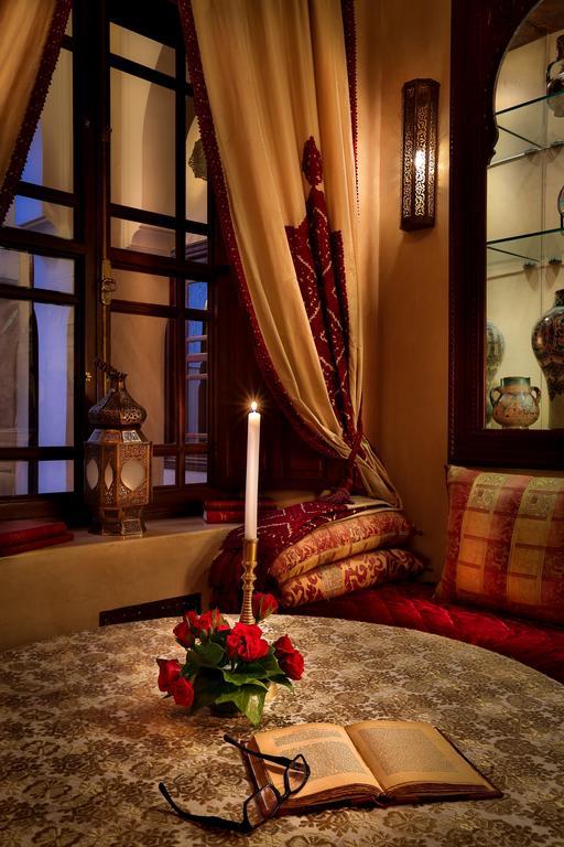 Riad Kniza Марракеш Экстерьер фото A candle in a Moroccan house