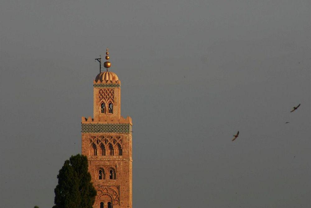 Riad Kniza Марракеш Экстерьер фото The minaret of the Kutubiyya Mosque in Marrakesh